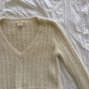 Fuzzy cropped long sleeve sweater with v neckline Urban Outfitters
